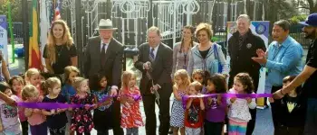 Council Member Koretz cutting the opening ribbon for a new playground